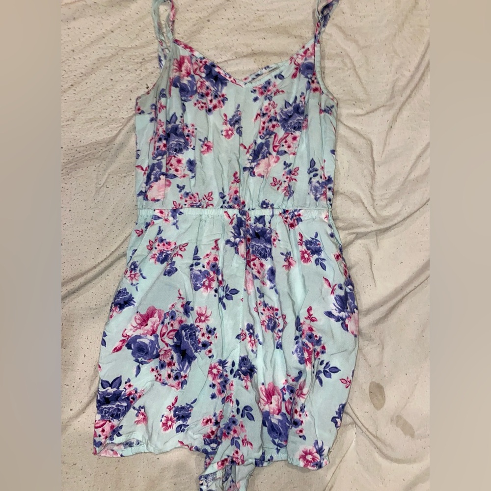 Flowery teal color romper.